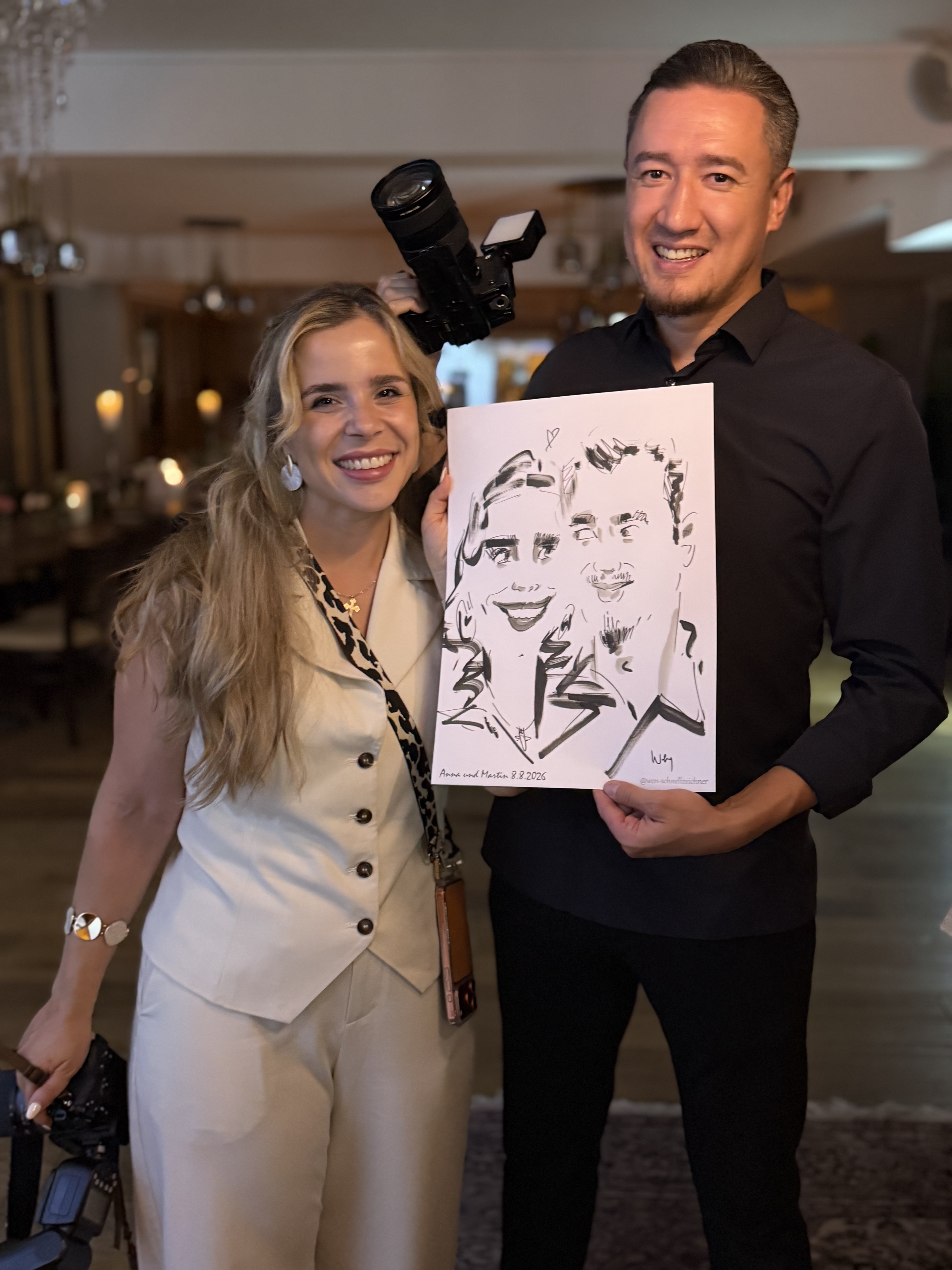 Couple presenting their live-drawn caricature together